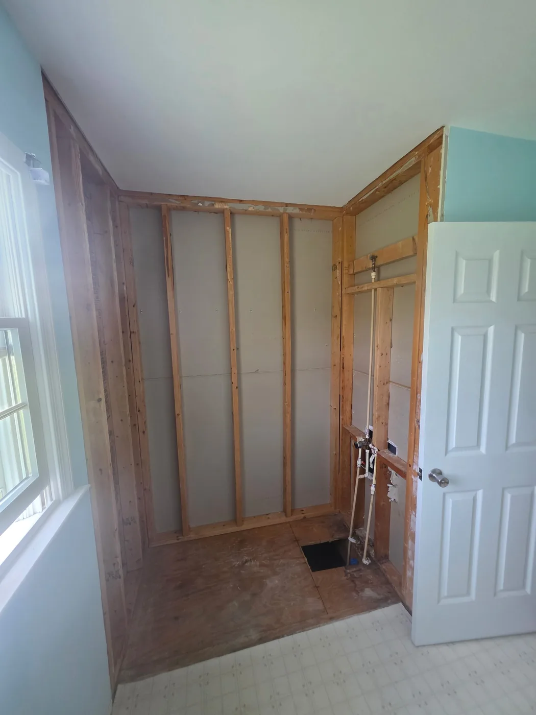 Tub surround removed and alcove stripped to studs during a Dagsboro DE bathroom remodel