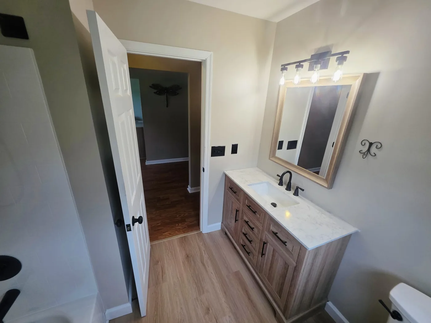 Completed bathroom remodel in Dagsboro Delaware viewed from the tub toward the vanity